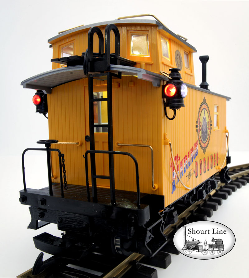 LGB 47656 Fandango in Durango 8-wheel Bobber Caboose + SL 8134230 13 LED High Efficiency dual ceiling fixtures and 2 coach LEDs + SL 8453303 Precision Train Throttle & LED controller + SL 6011604 Extreme low drag power pick-up for LGB two axle trucks + 2 each PIKO 36161 Metal Wheel sets + 10,000uF buffer anti-flicker capacitor rear viw