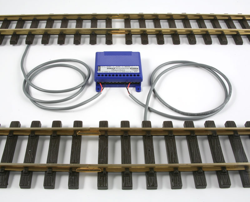 The Massoth ME_8170001 Feedback Module with two track contacts placed under the tracks